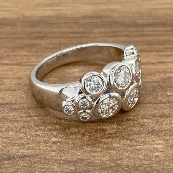 Diamond ring with cluster of stones.