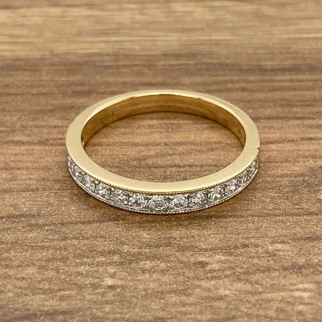 Gold band with diamond eternity ring.