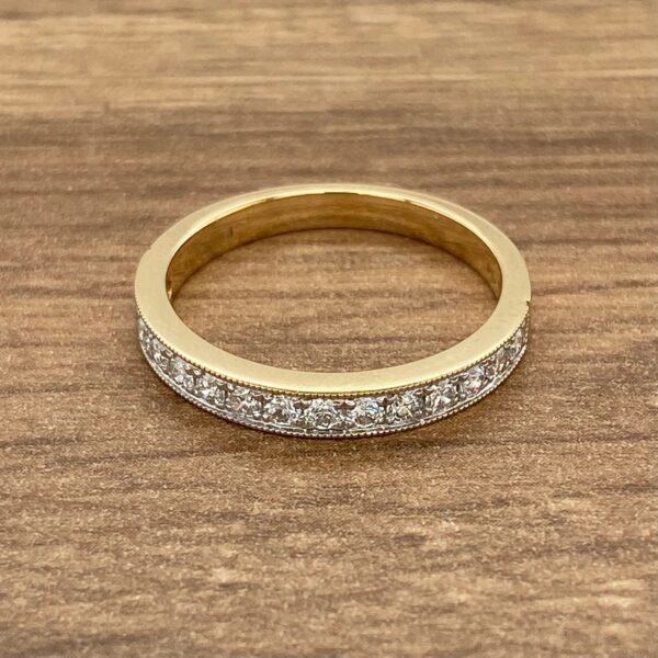 Gold band with diamond eternity ring.