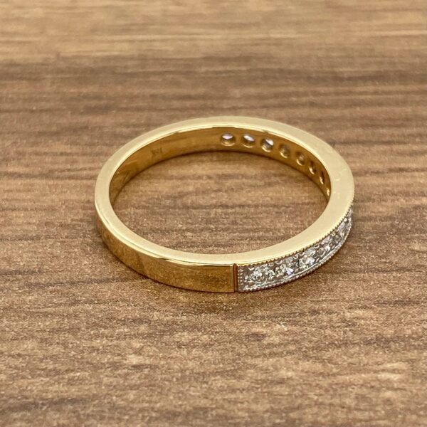 Gold band with diamond accents.