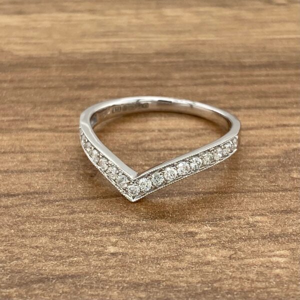 Diamond V-shaped wedding band ring.