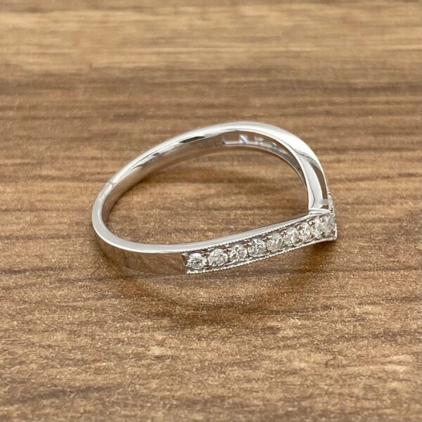 Diamond V-shaped wedding band ring.