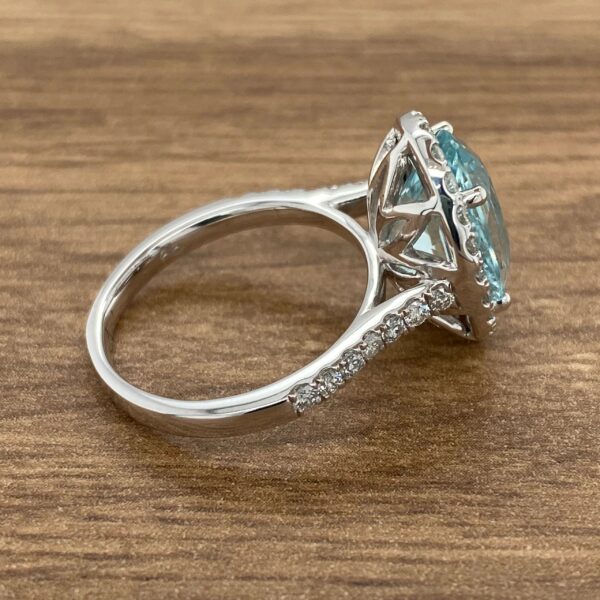 Aquamarine engagement ring with diamond band.