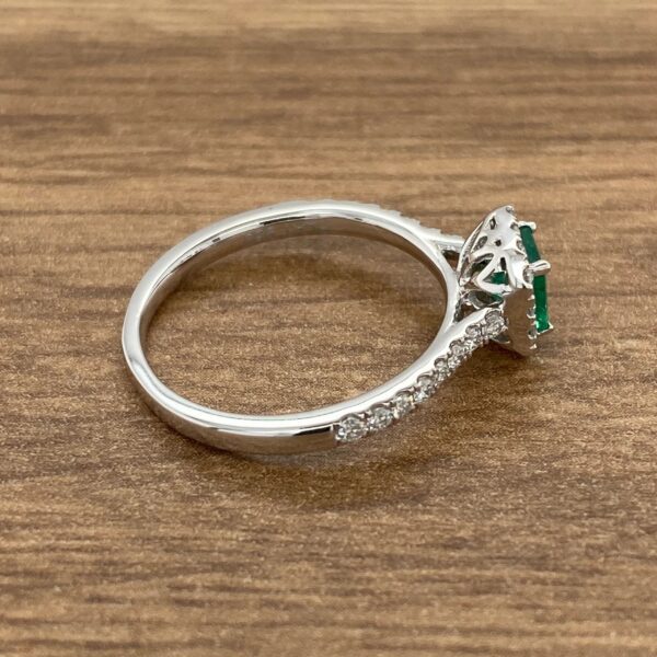 Emerald and diamond engagement ring.