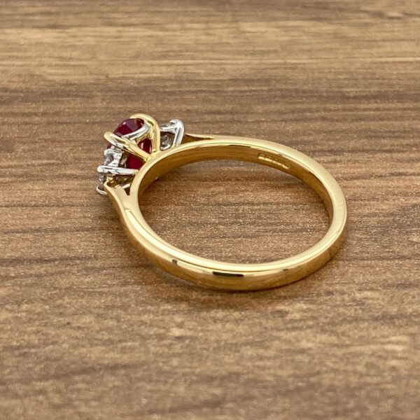 Gold ring with ruby and diamond stones.