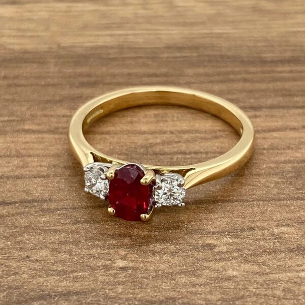 Gold ring with ruby and diamond stones.