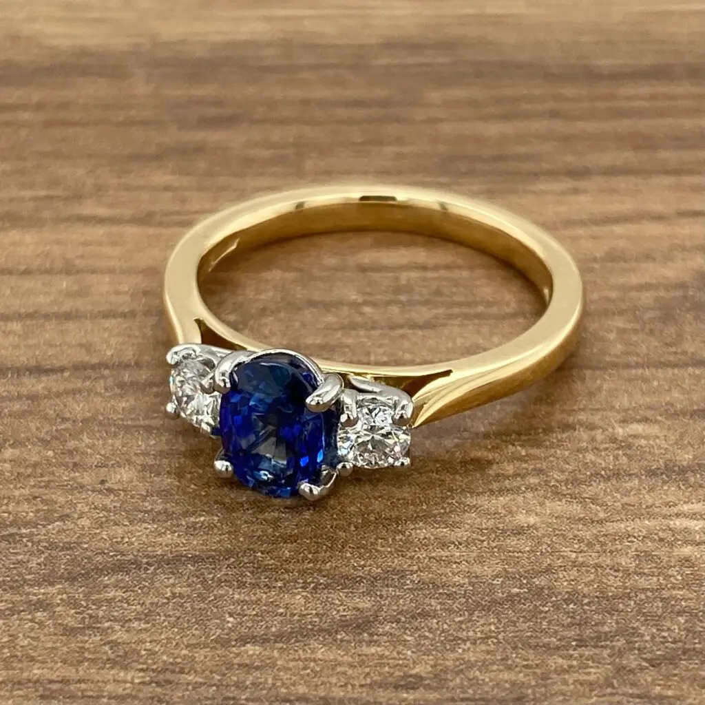 Gold ring with sapphire and diamond stones.