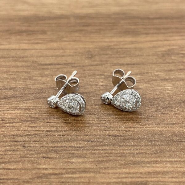 Diamond pear-shaped stud earrings.