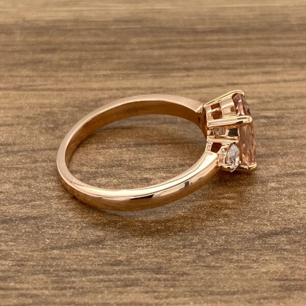 Rose gold ring with pink gemstone.