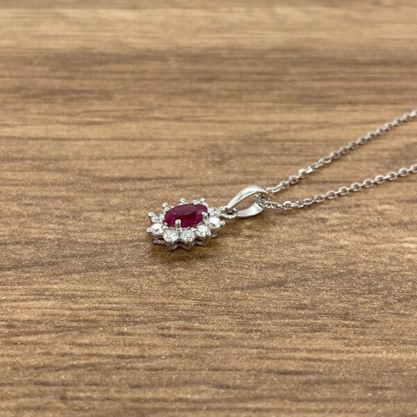 Silver chain with ruby and diamond pendant.