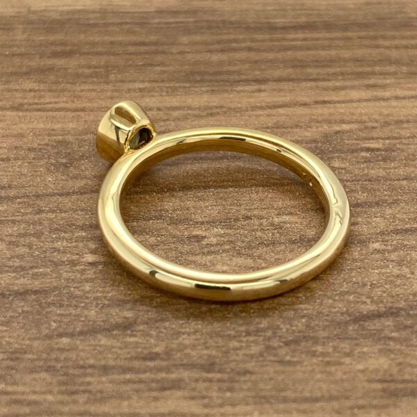 Gold ring with a single stone.