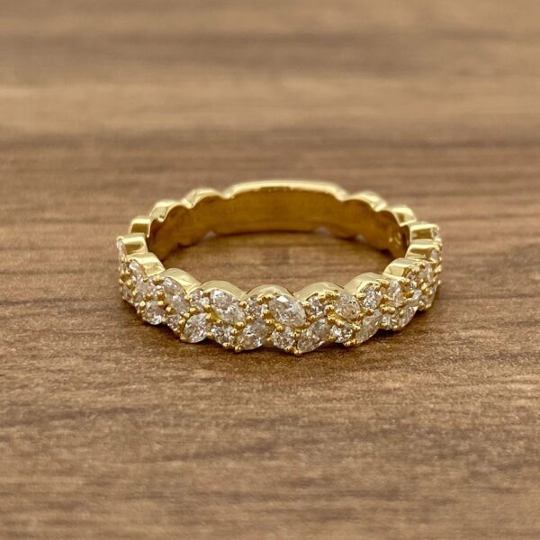 Gold band with diamond leaf design.