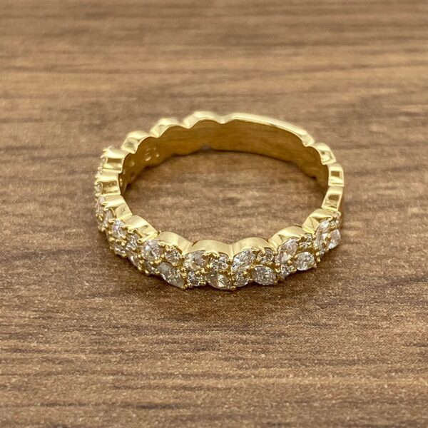 Gold band with diamond encrusted detail.