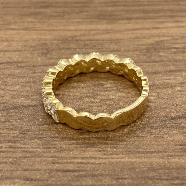 Gold ring with diamond accents.