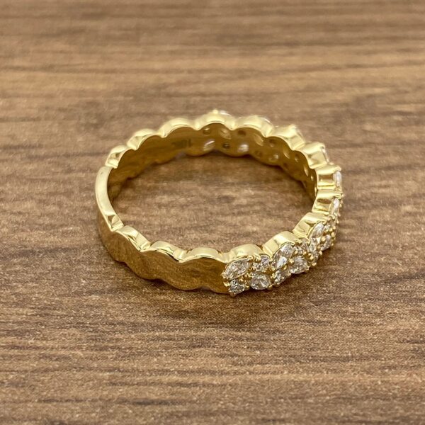 Gold ring with pave diamond setting.