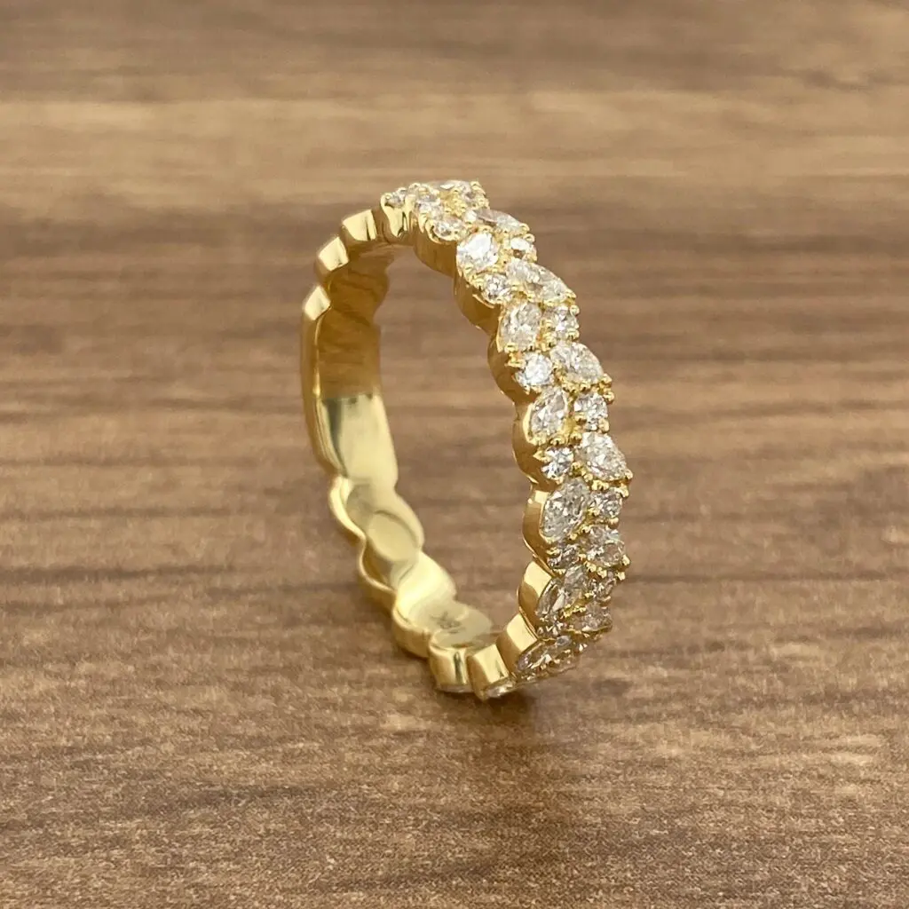 Gold band with pave diamond setting.