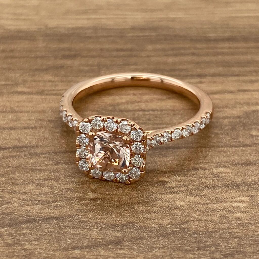 Rose gold ring with a halo setting.