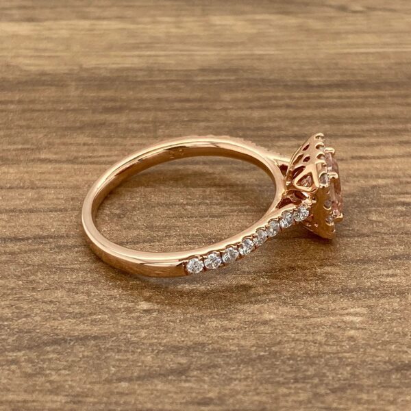 Rose gold engagement ring with halo setting.