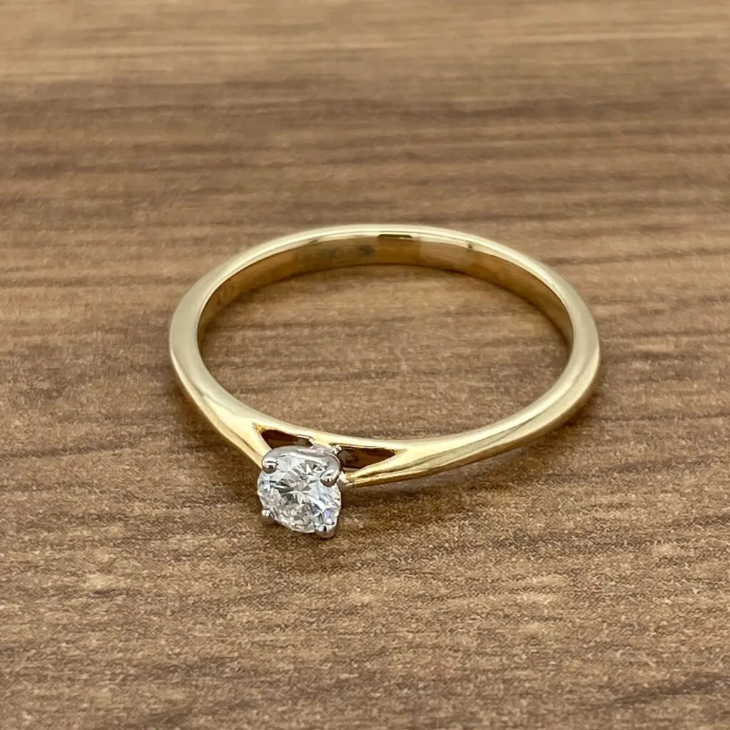 Gold band with a single diamond.