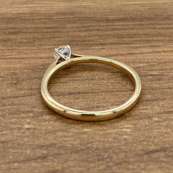 Gold band with a single diamond.