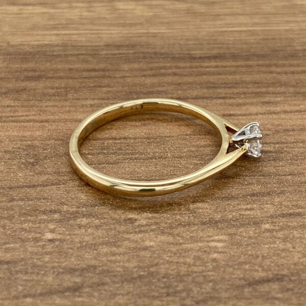 Gold band with a single diamond.