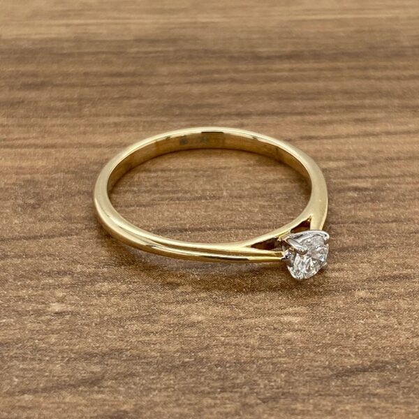 Gold ring with a single diamond.