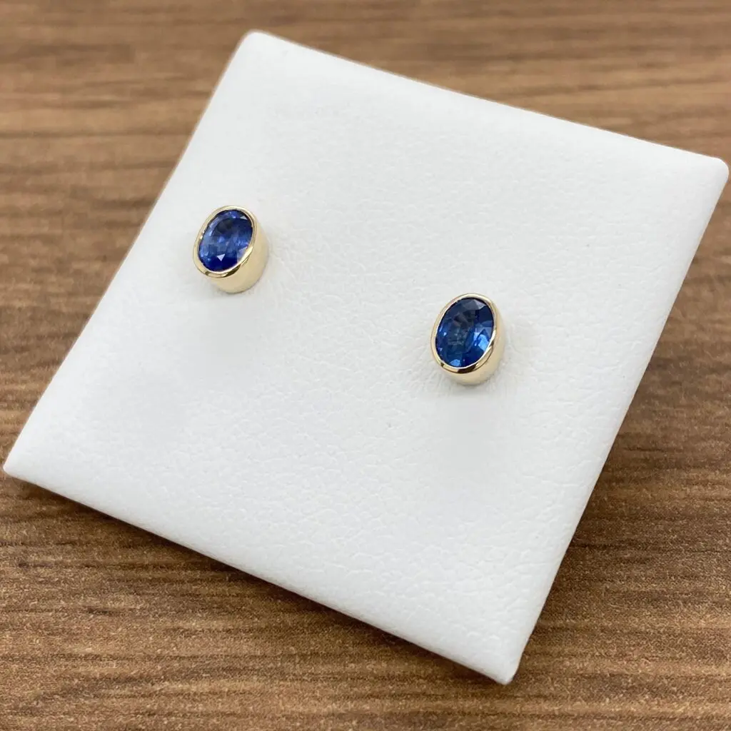 Pair of gold sapphire stud earrings.