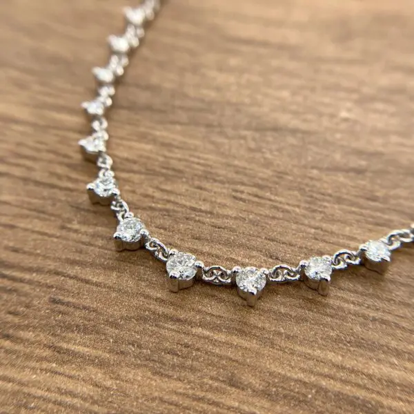 Diamond necklace on wood background.