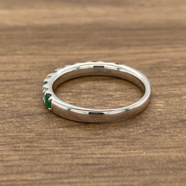 Emerald and diamond wedding band.