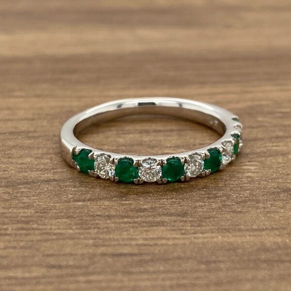 Emerald and diamond eternity band ring.