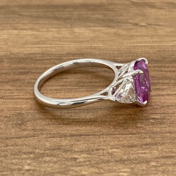 Purple sapphire and diamond engagement ring.