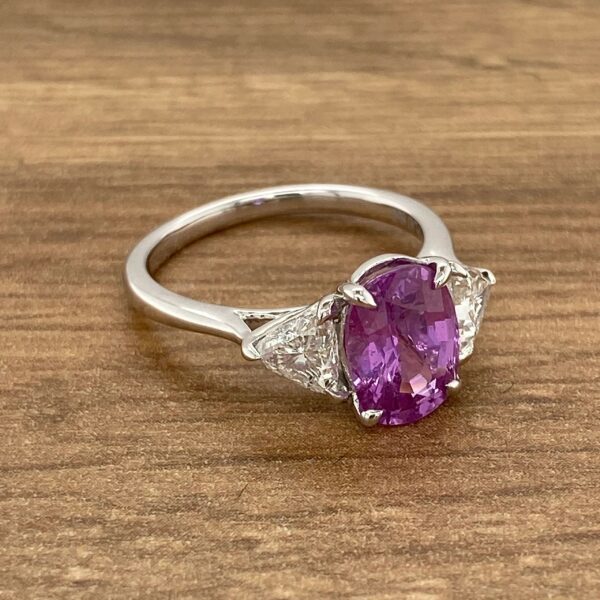 Purple sapphire engagement ring with diamonds.