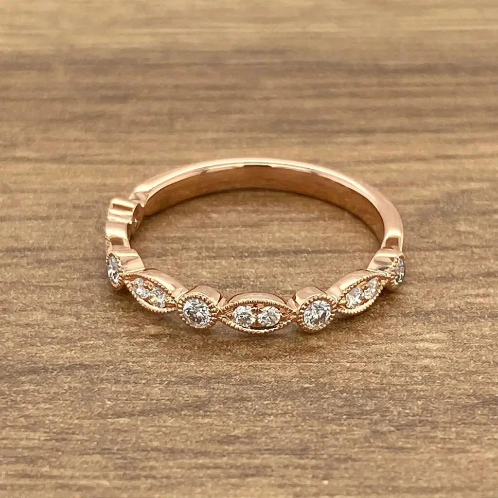 Rose gold band with pave diamonds.