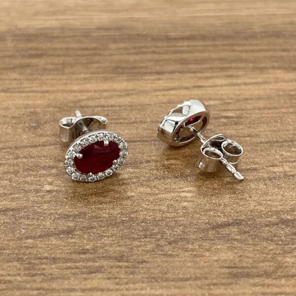 Ruby and diamond halo stud earrings.