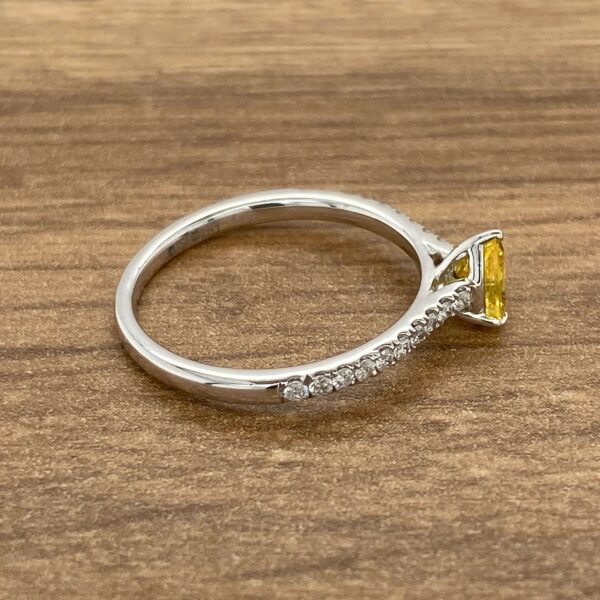 Diamond and yellow sapphire engagement ring.