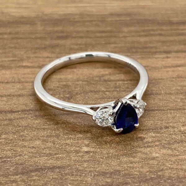 Pear-shaped sapphire and diamond ring.