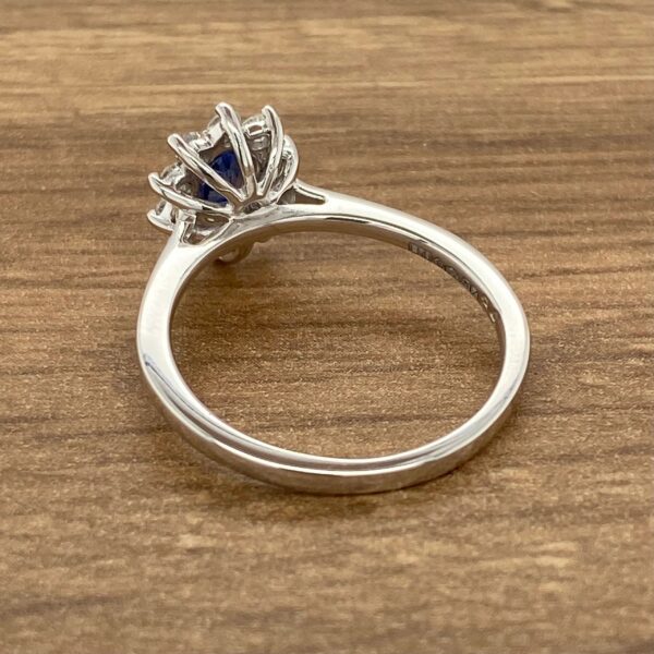 Silver ring with a blue sapphire.