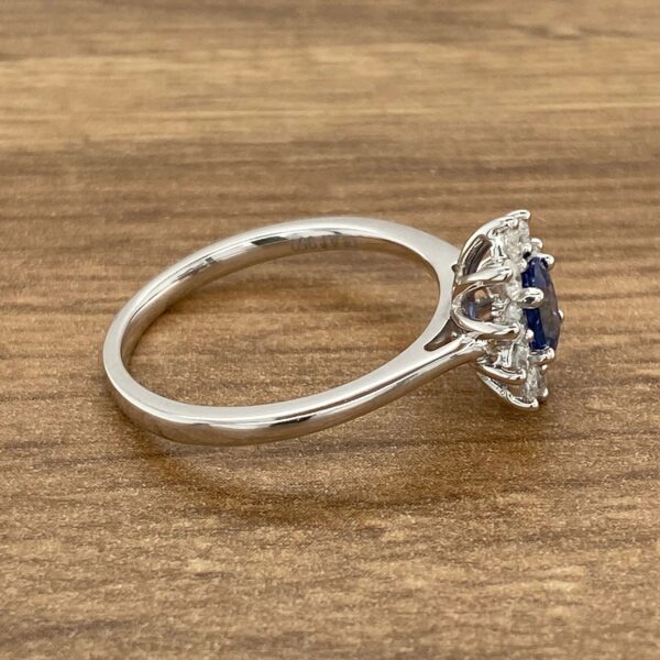 Silver ring with blue sapphire and diamonds.