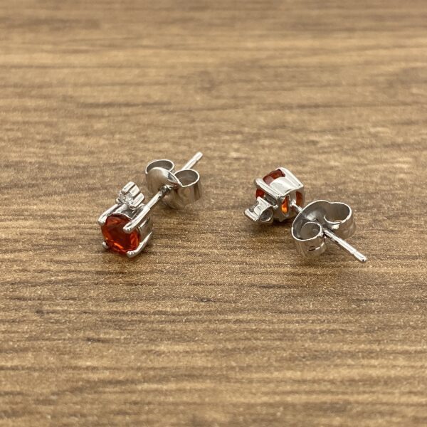 Pair of red gemstone stud earrings.