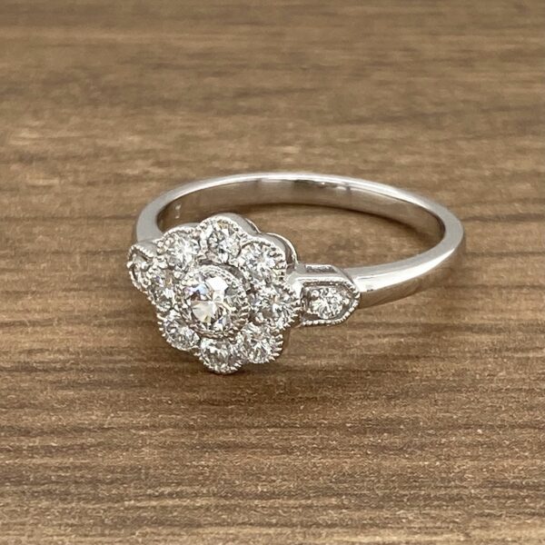 Diamond engagement ring with flower setting.