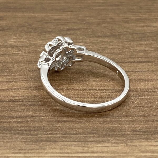 Diamond ring with floral design.