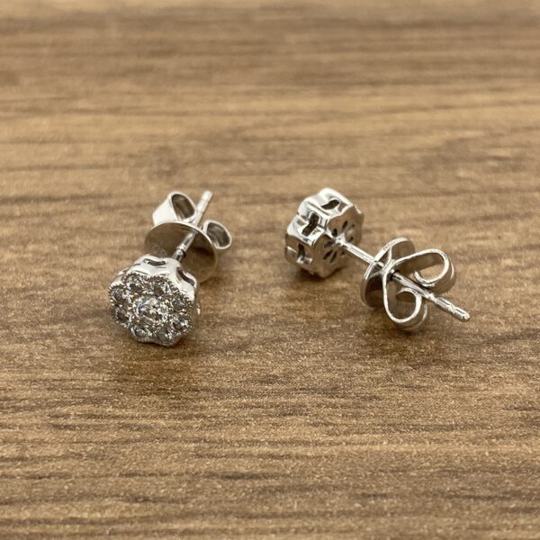 Pair of diamond flower stud earrings.