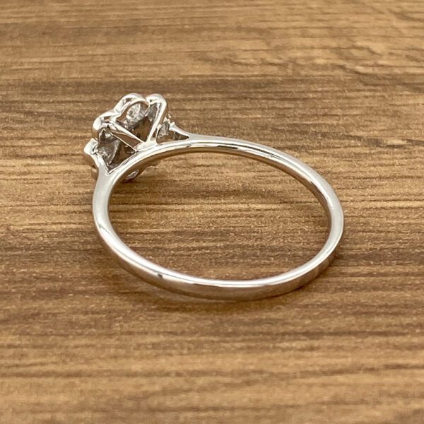 Silver ring with a diamond setting.