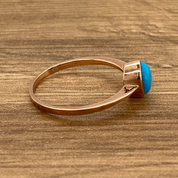 Rose gold ring with turquoise stone.