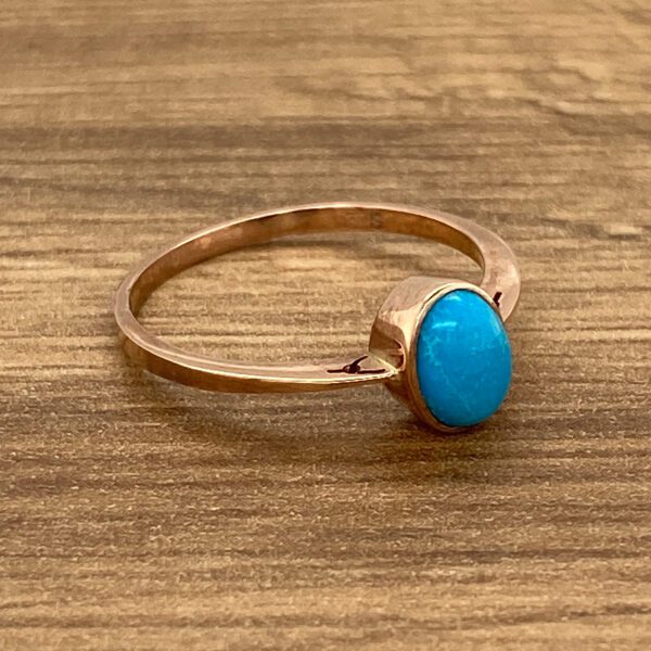 Rose gold ring with turquoise stone.