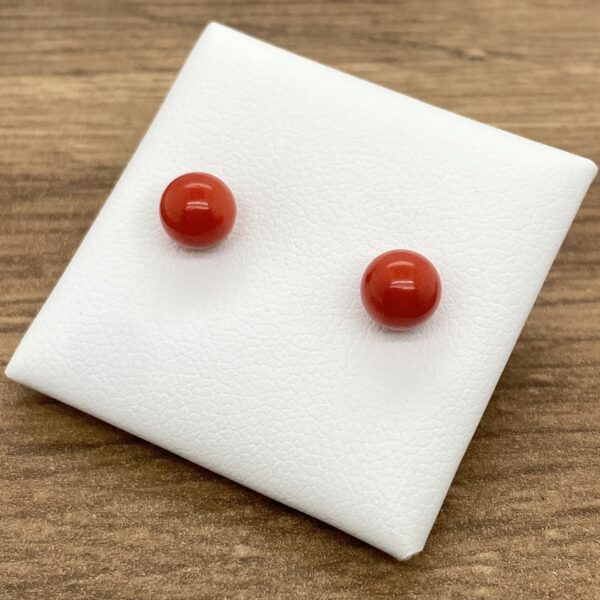 Red coral round stud earrings.