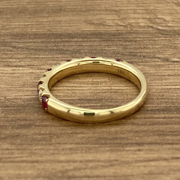 Gold band with red ruby stones.