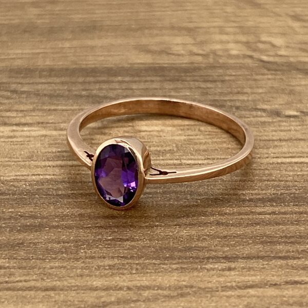 Rose gold ring with amethyst stone.