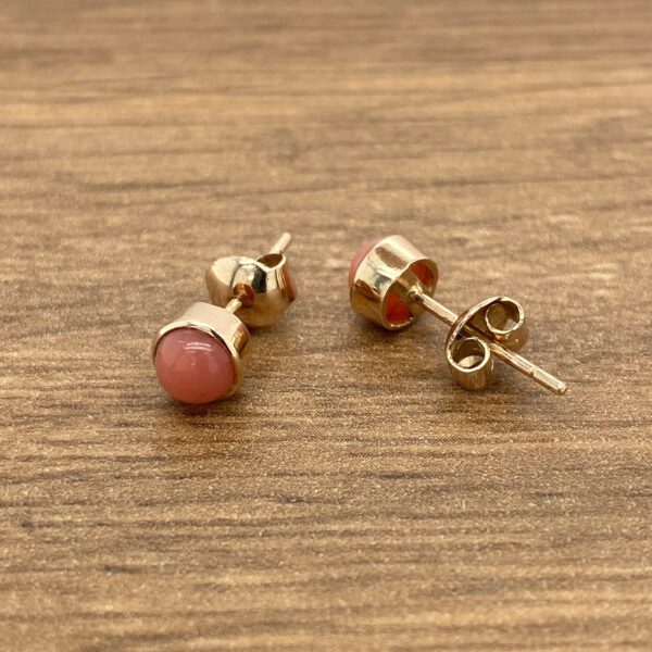 Pink stone gold stud earrings.