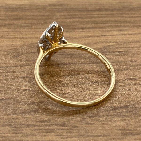 Gold ring with a diamond setting.